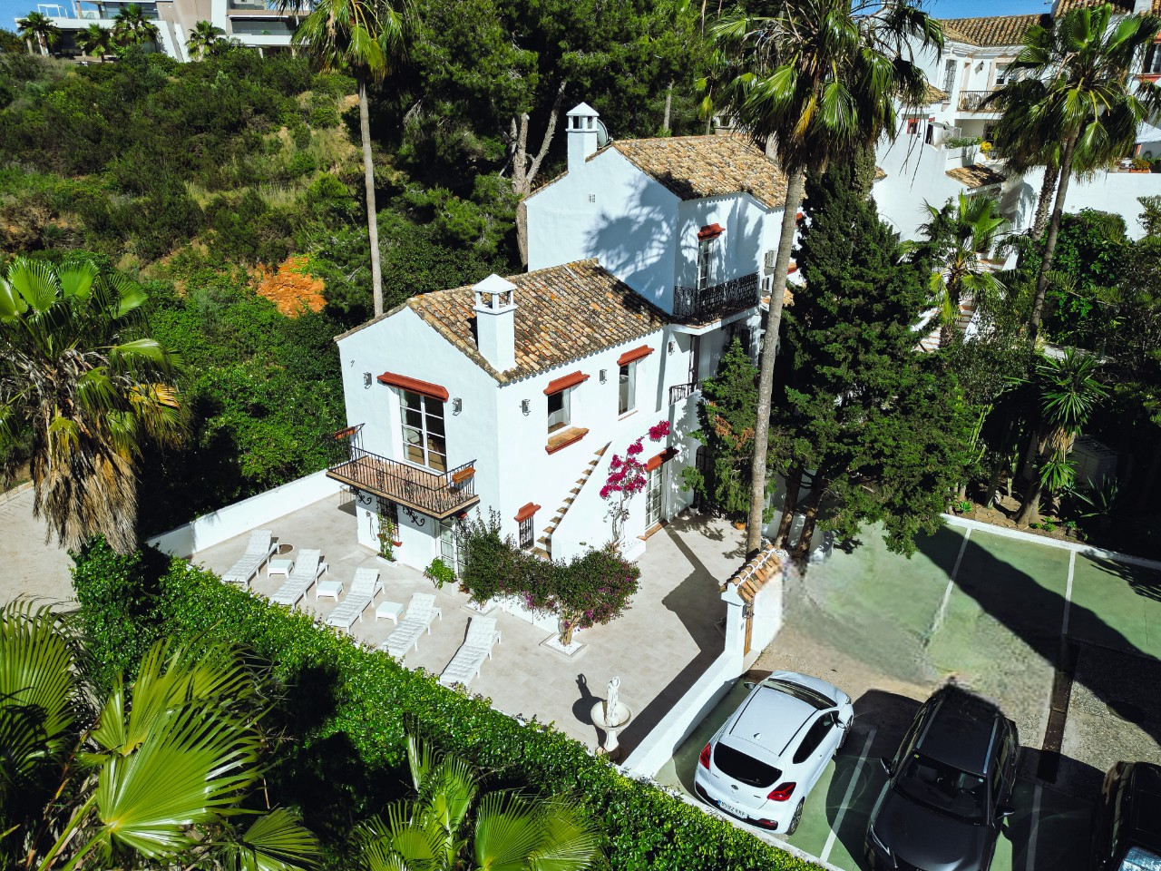 Casa Patricia aerial view showing white villa with terrace and parking