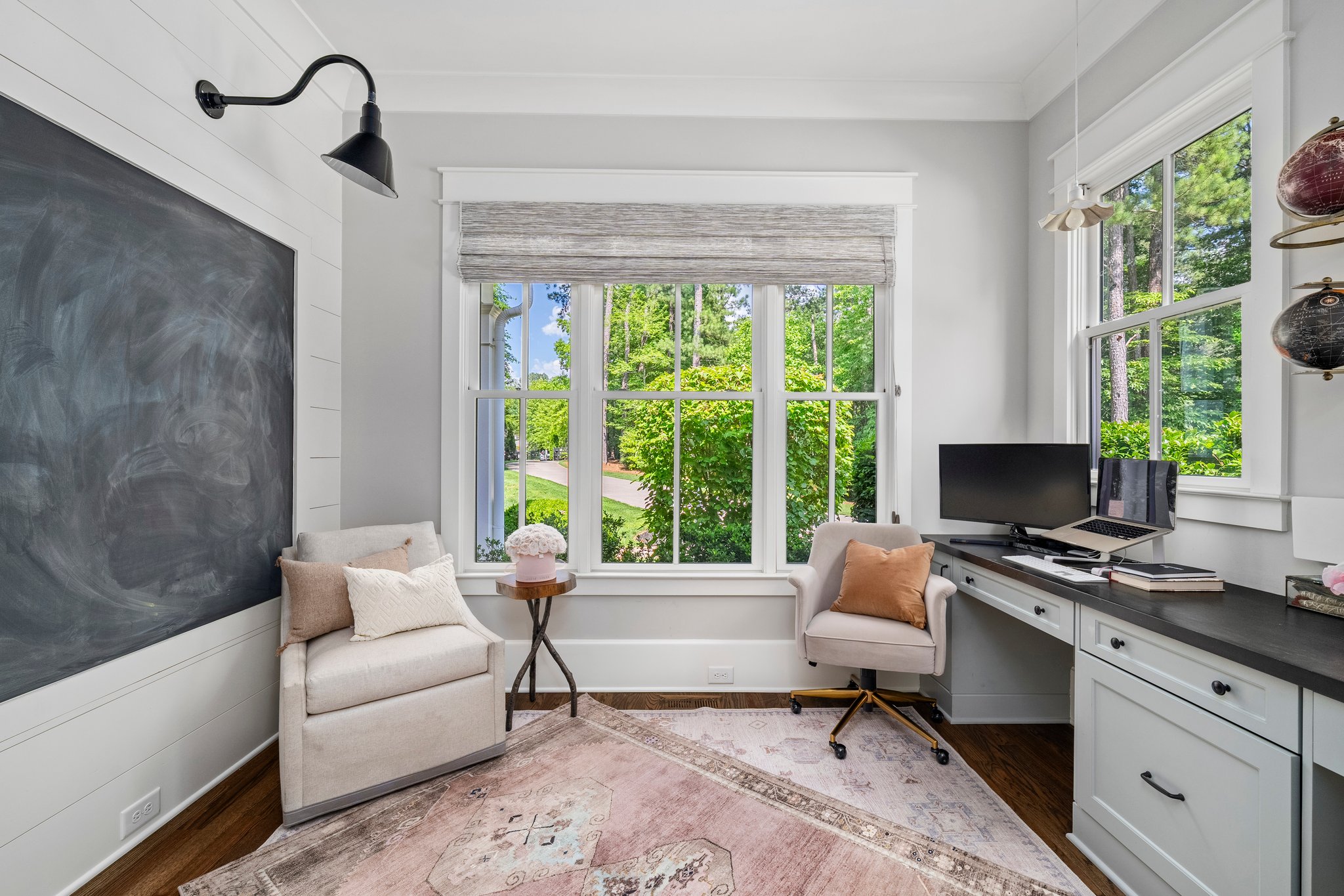 Modern home office with built-in desk and garden view