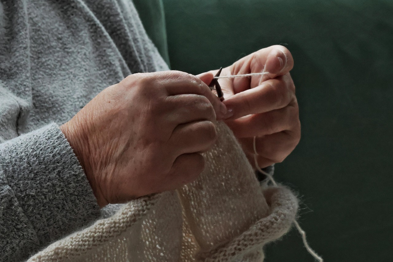 Woman knitting with alpaca yarn