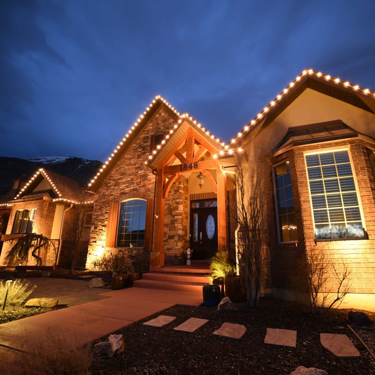 Featured Christmas light installation with elegant roofline and entrance lighting by LITUP Vancouver