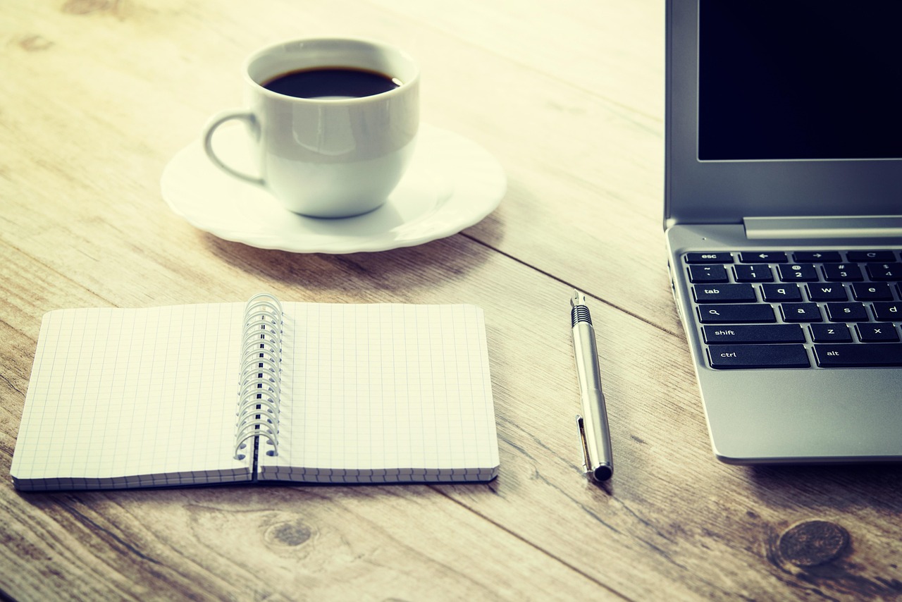 Comfortable workspace with coffee and laptop