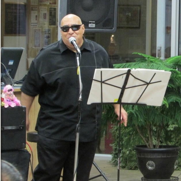 Samuel Lozada Playing Harmonica