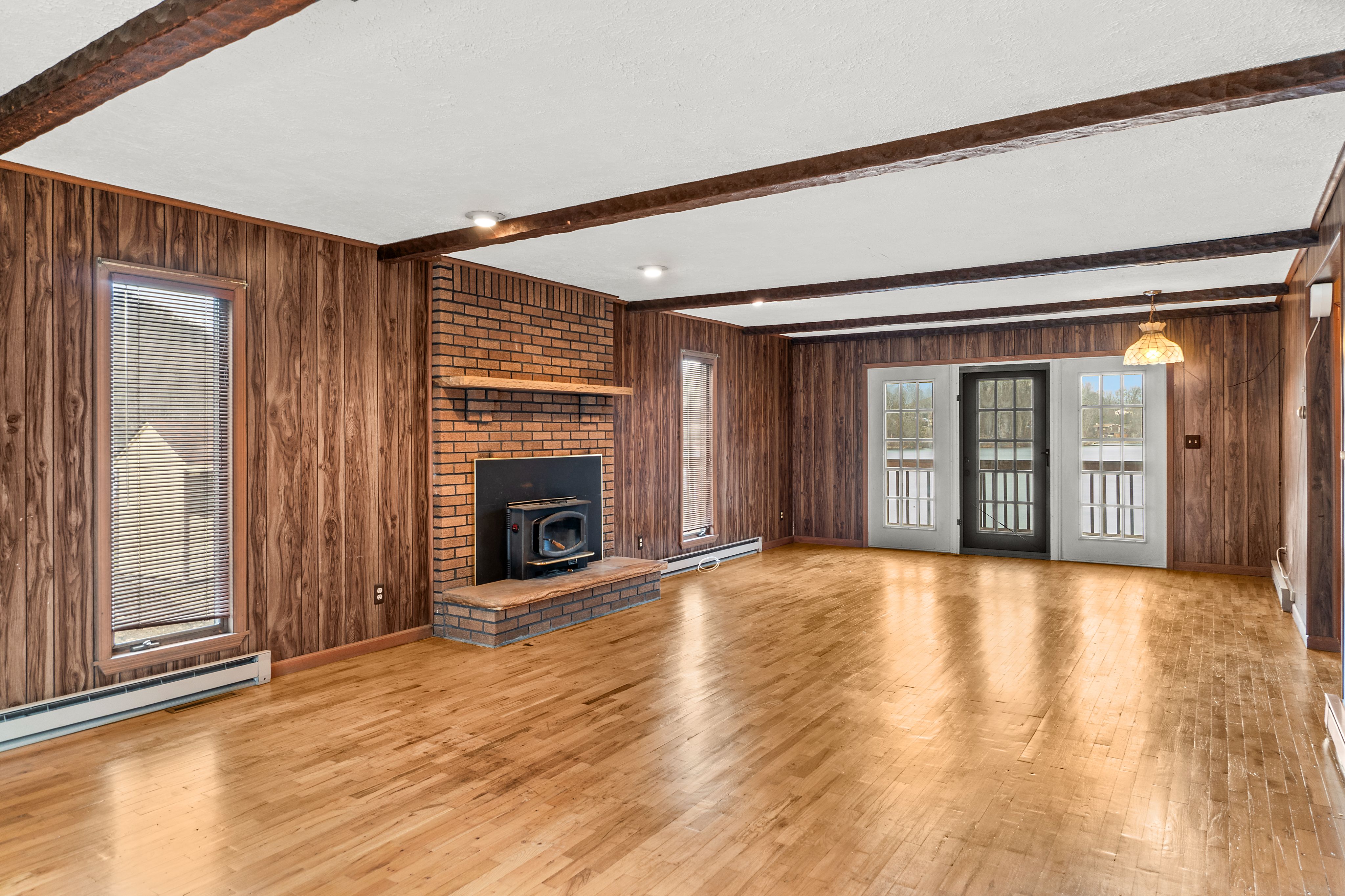 Open living space with wood paneling