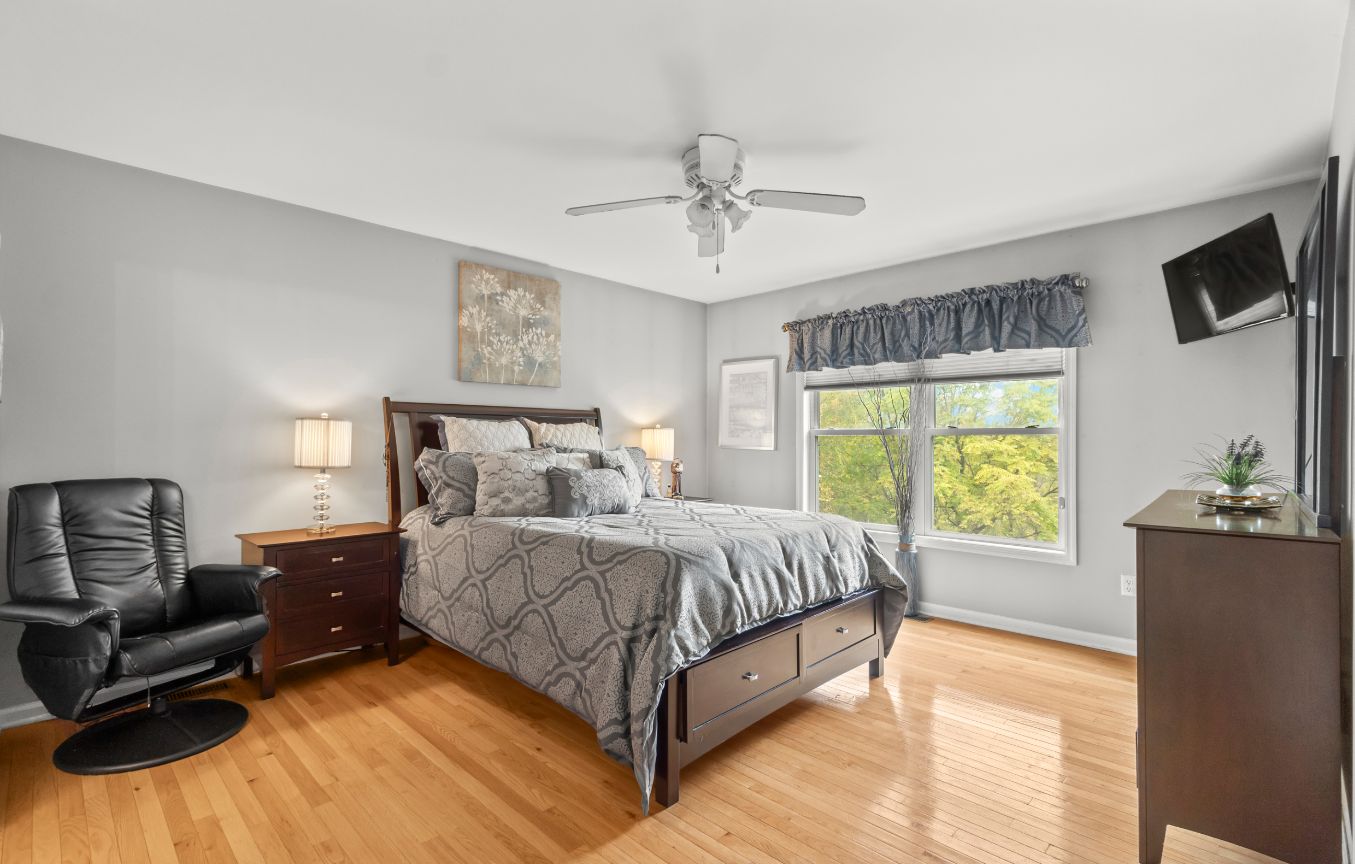 Cozy bedroom with hardwood floors