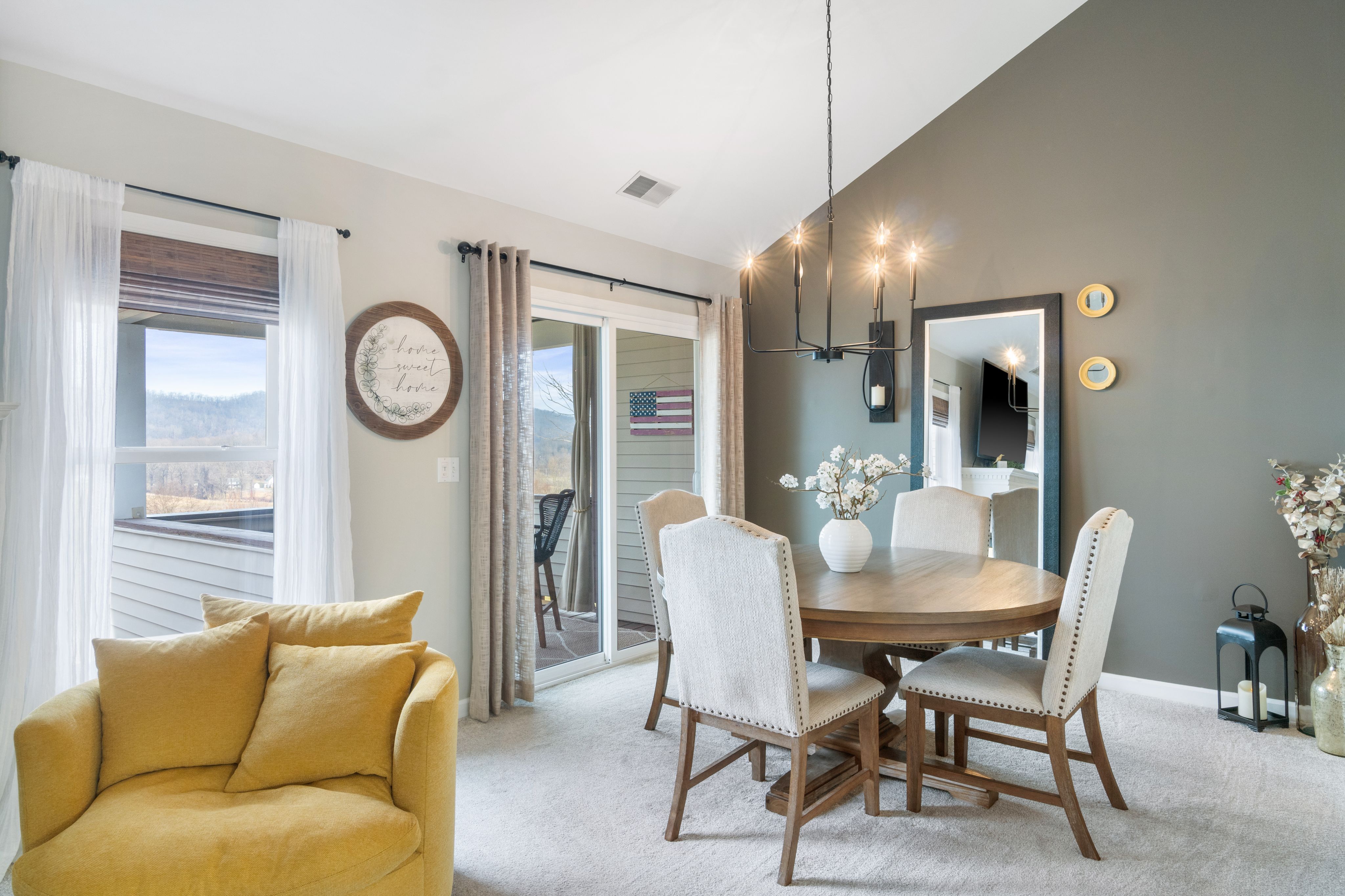 Dining room with yellow accent chair