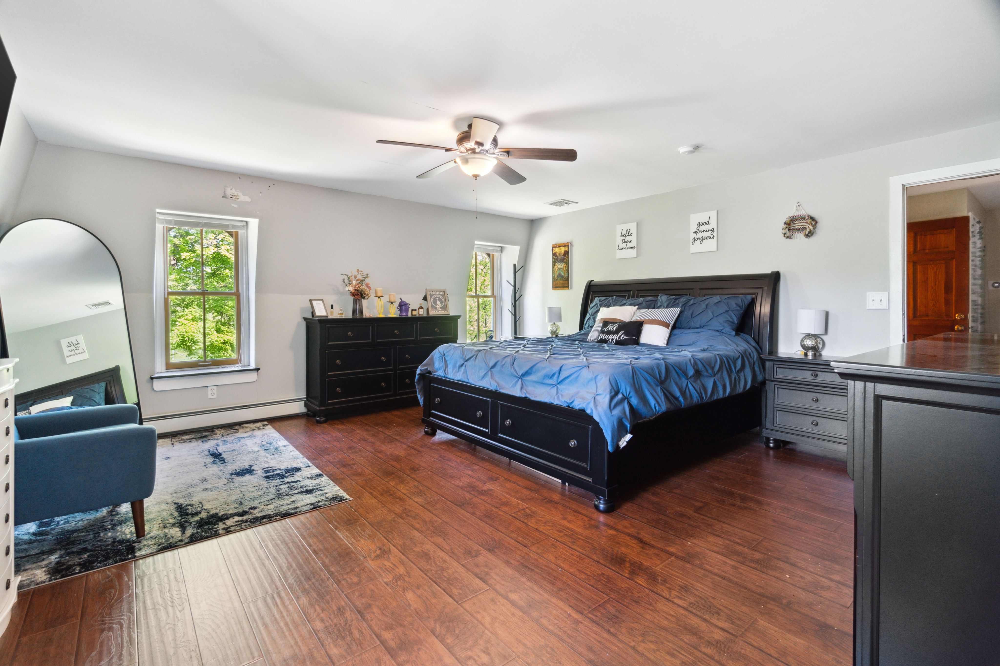 Master bedroom with dark furniture