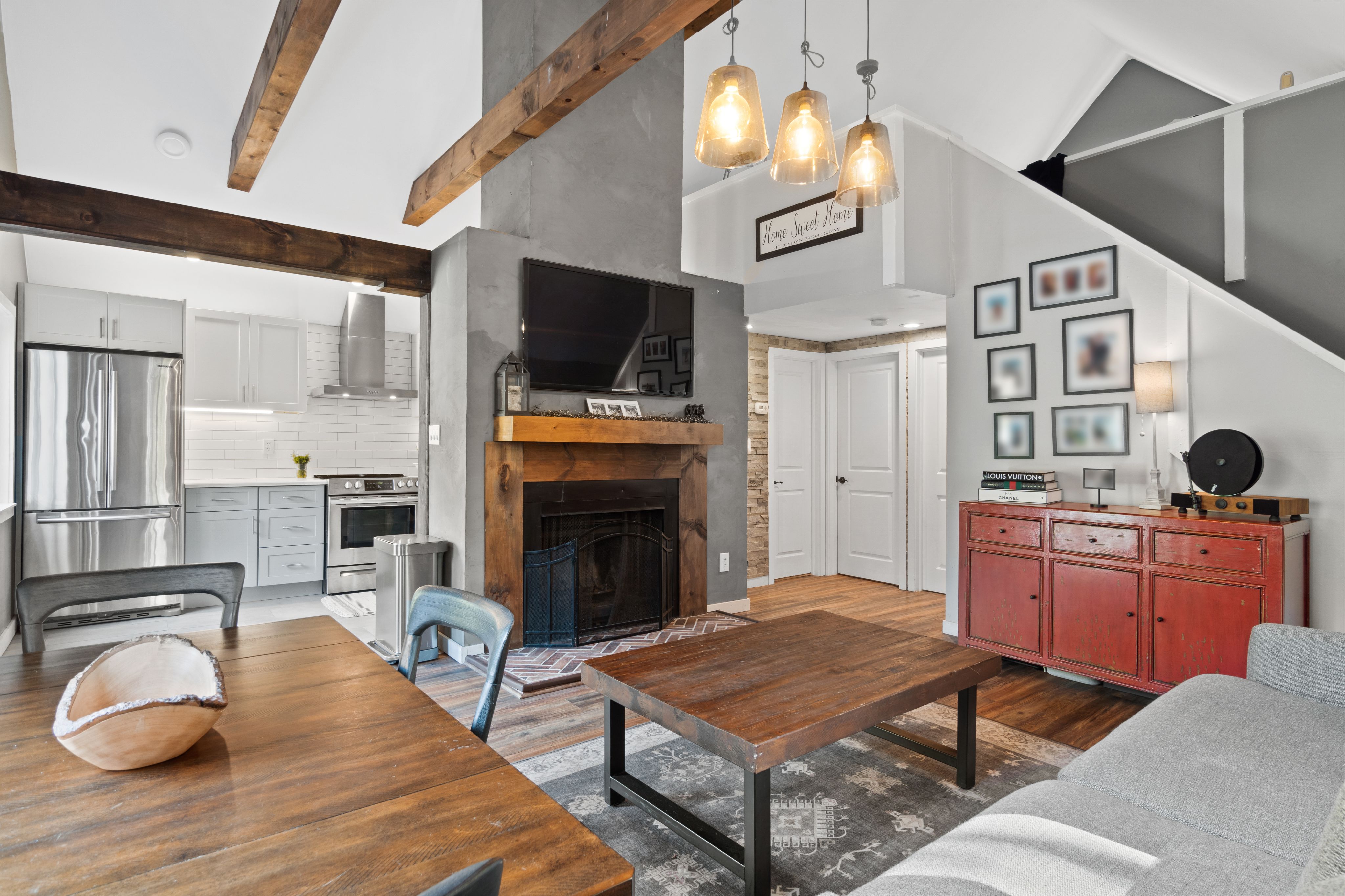 Living room with fireplace and exposed beams
