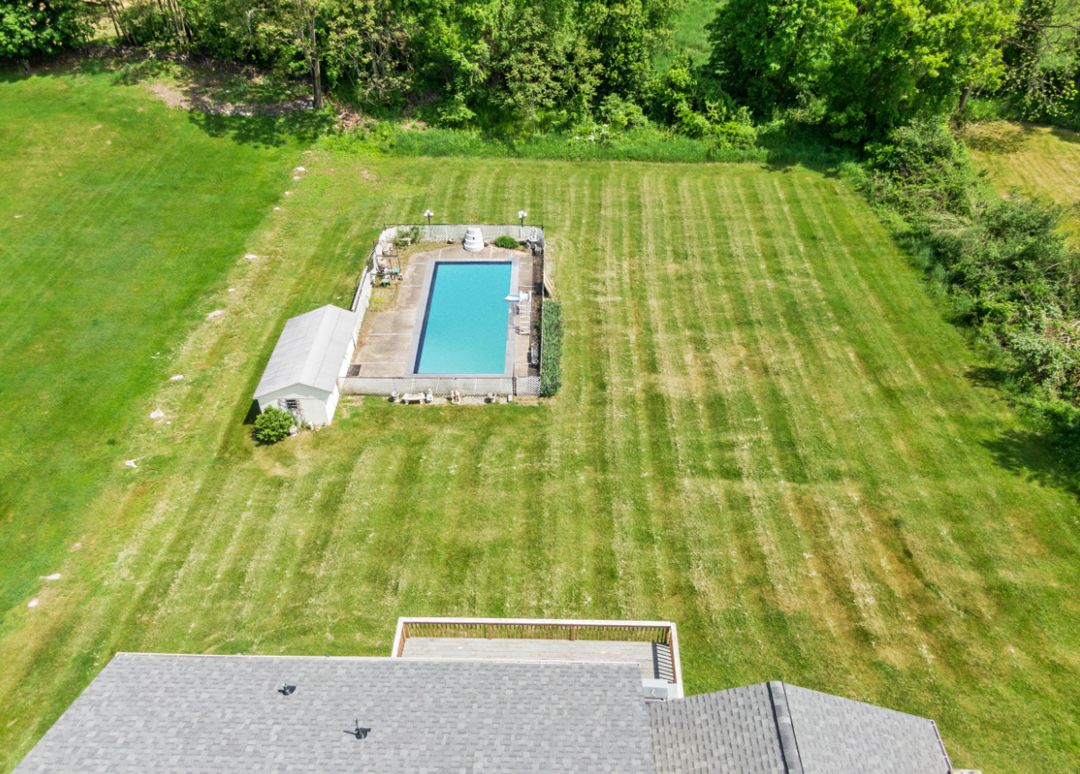 Aerial view of property with pool