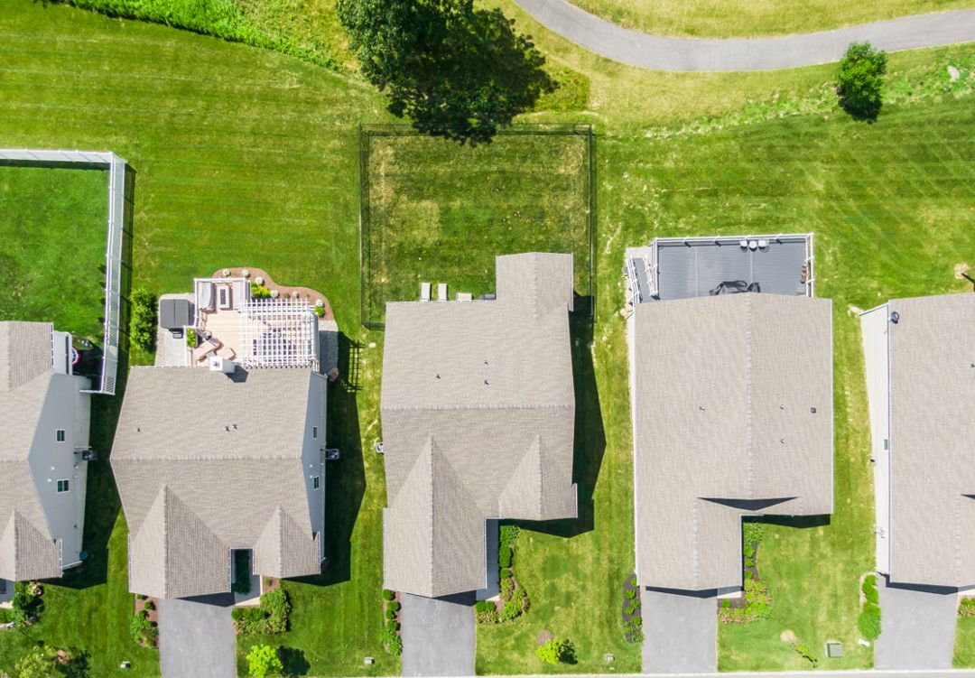 Top-down aerial view of suburban homes