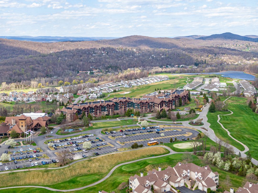 Aerial view of modern home with large driveway