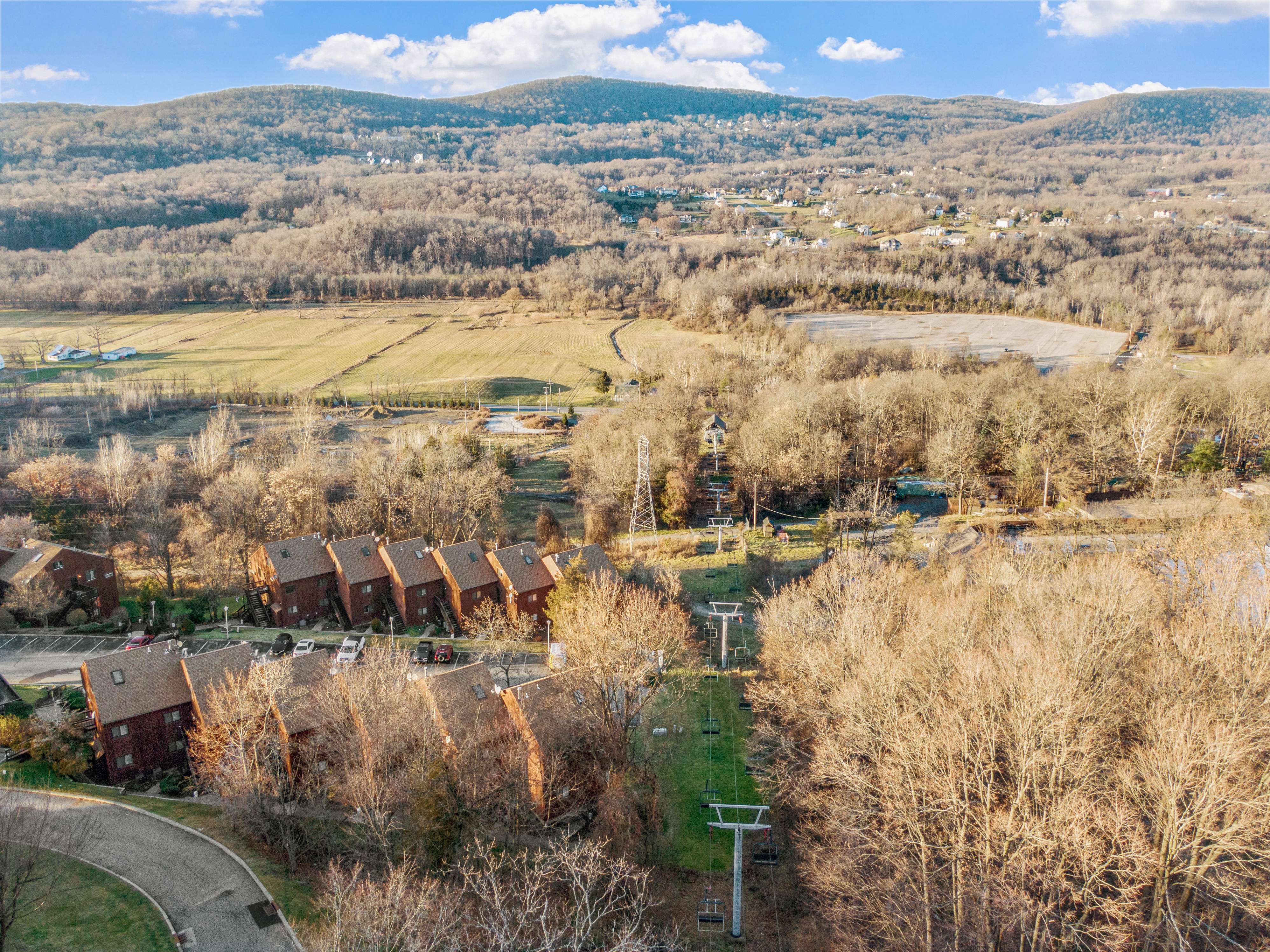 Aerial view of townhomes with mountain backdrop