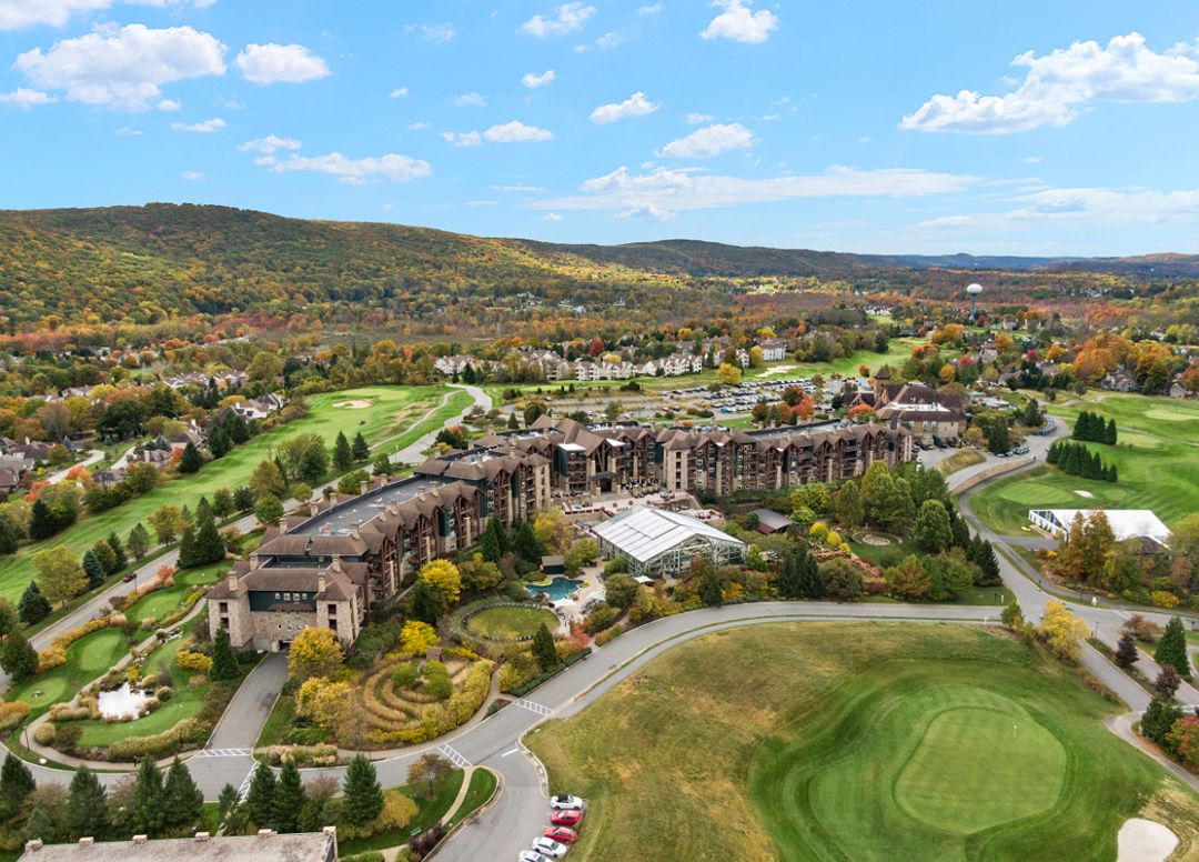 Aerial view of golf course resort with pools