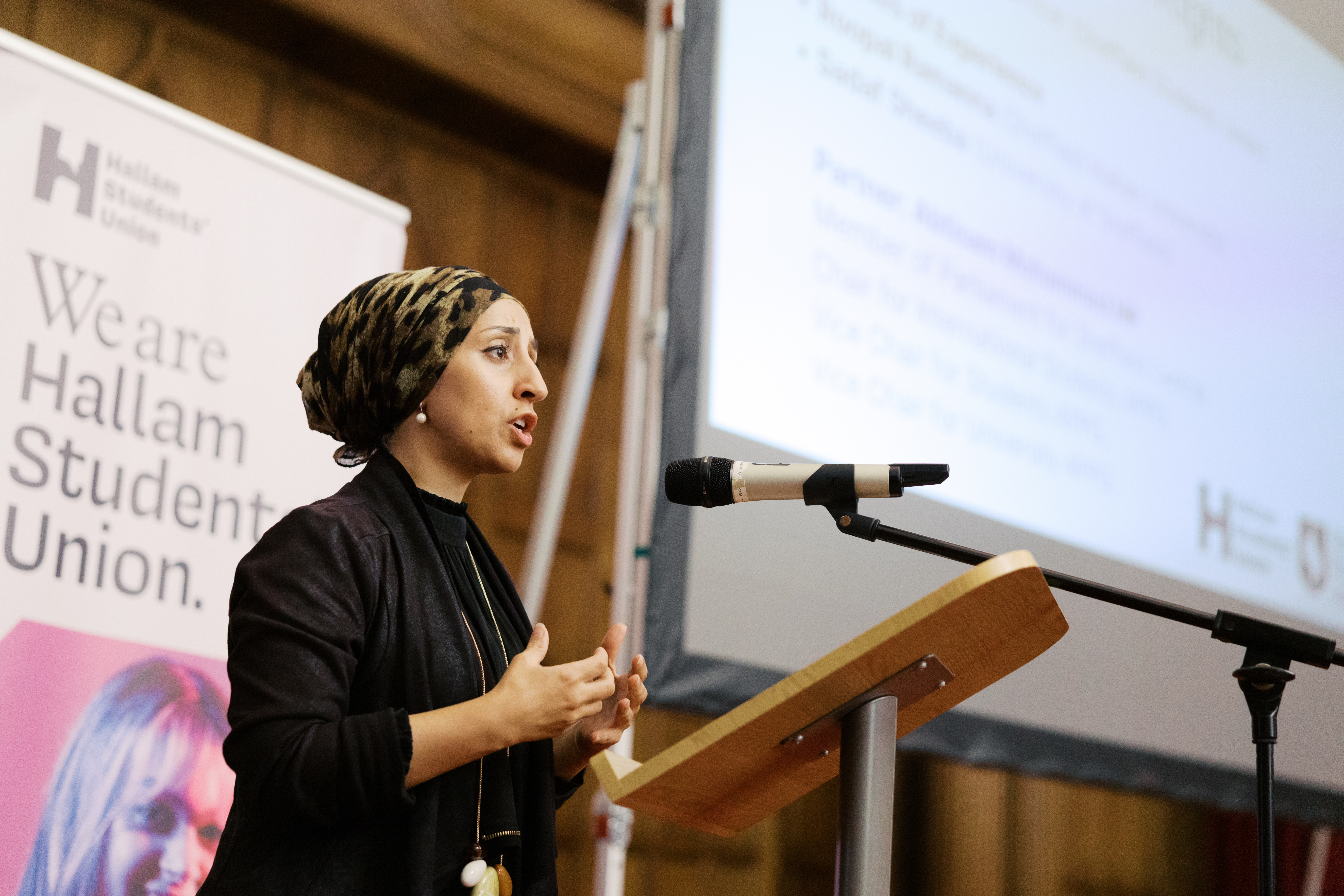 Student speaking at microphone