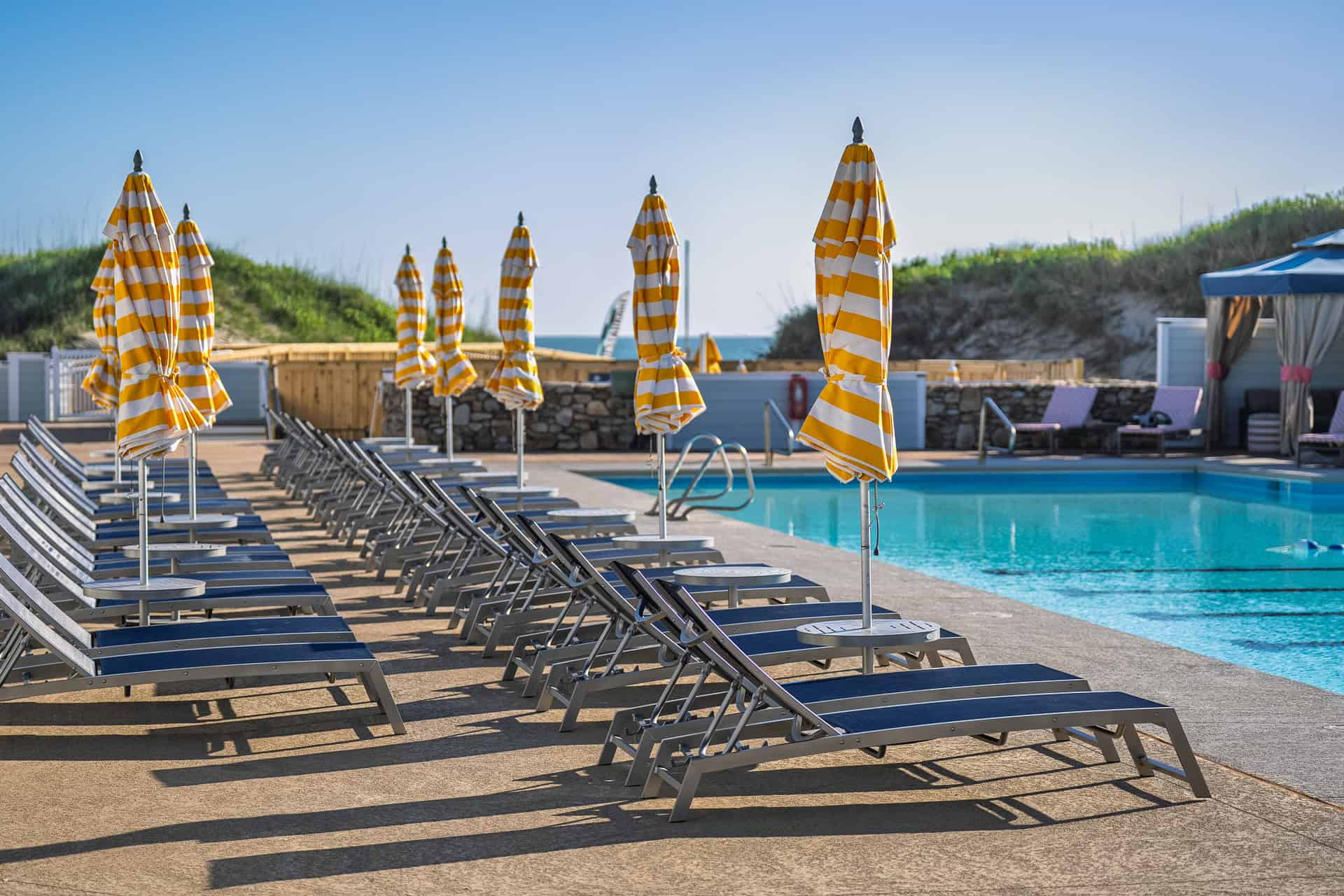 Pool Deck with Striped Umbrellas