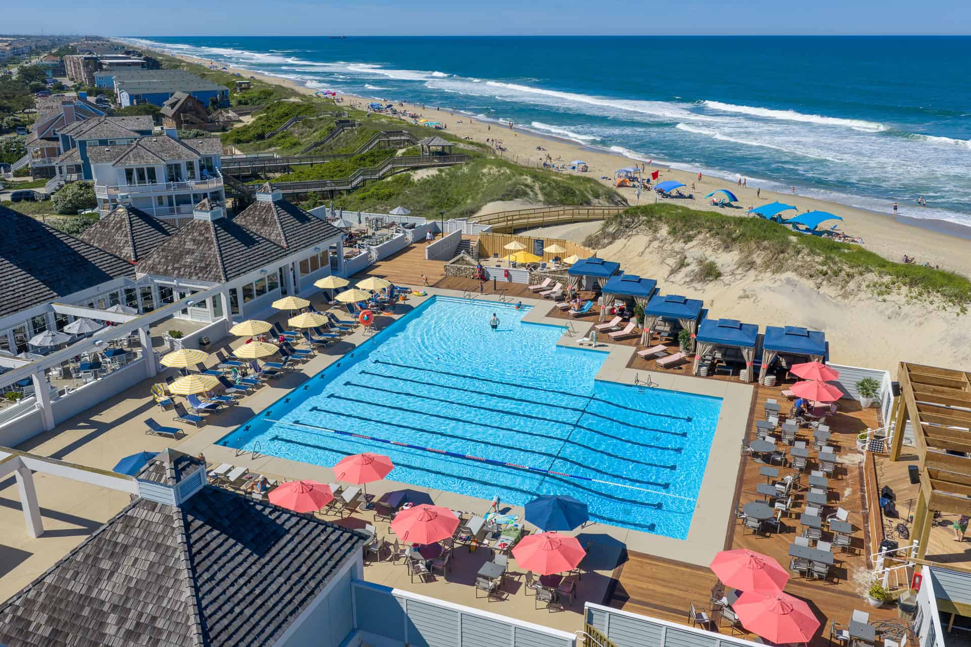 Aerial view of Village Beach Club with pickleball courts