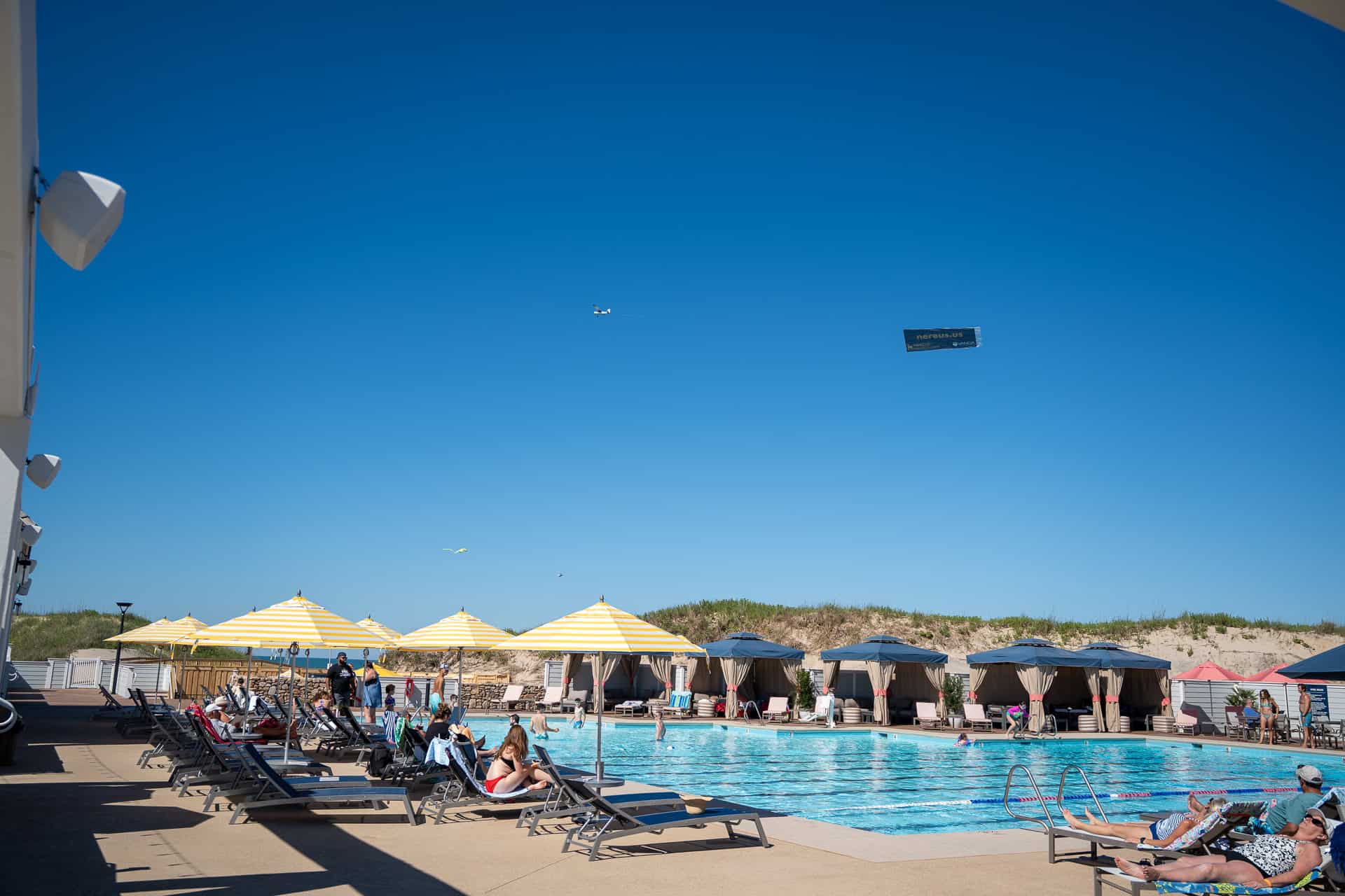Village Beach Club oceanfront pool with cabanas