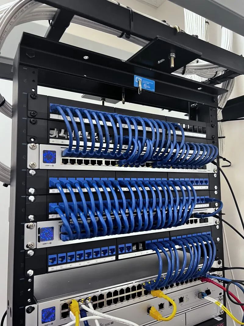 Commercial network rack with organized patch panels and structured cabling